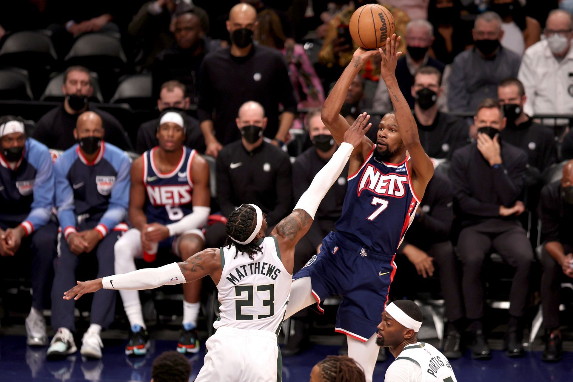 Kevin Durant #7 of the Brooklyn Nets shoots the ball defended by Wesley Matthews #23 of the Milwaukee Bucks during the third quarter at Barclays Center on January 07, 2022 in New York City.