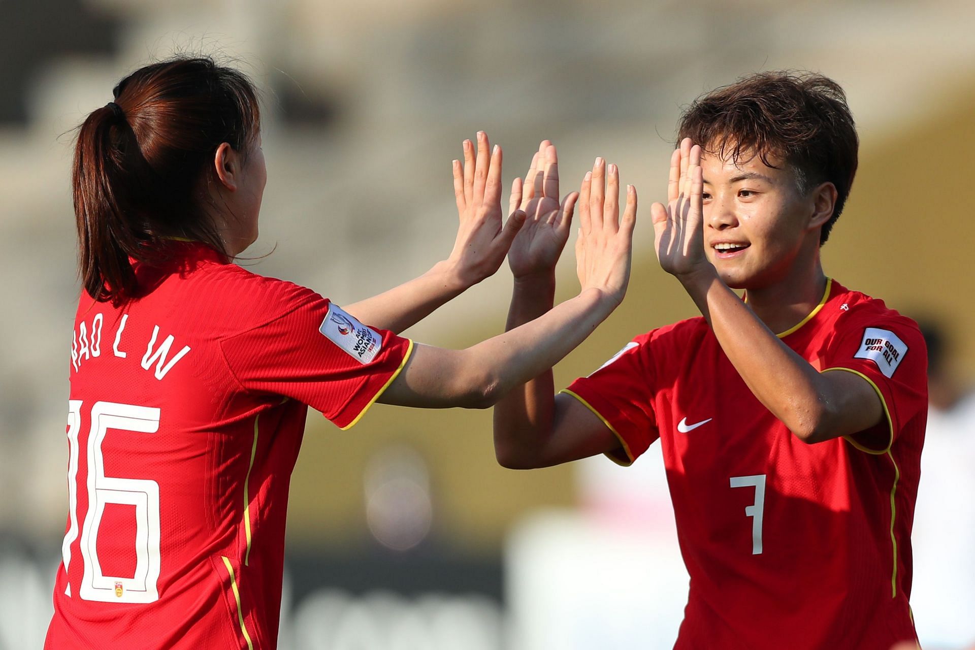 Wang Shuang celebrates her second goal of the game.