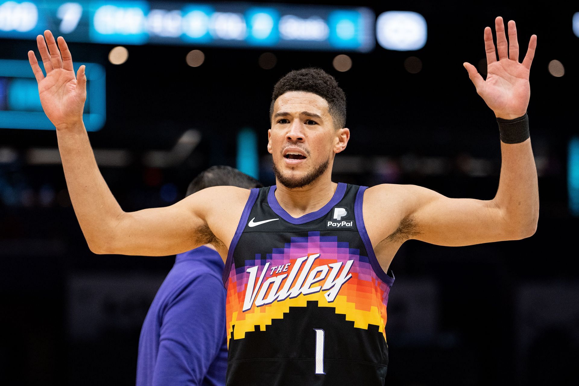 Phoenix Suns' Devin Booker reacts to the referee's decision during a game against the Charlotte Hornets on January 2 in Charlotte, North Carolina.