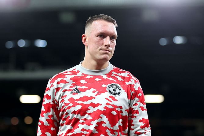 WATCH: Phil Jones taps Manchester United badge and leaves the pitch in tears as fans chant his name after Wolves defeat