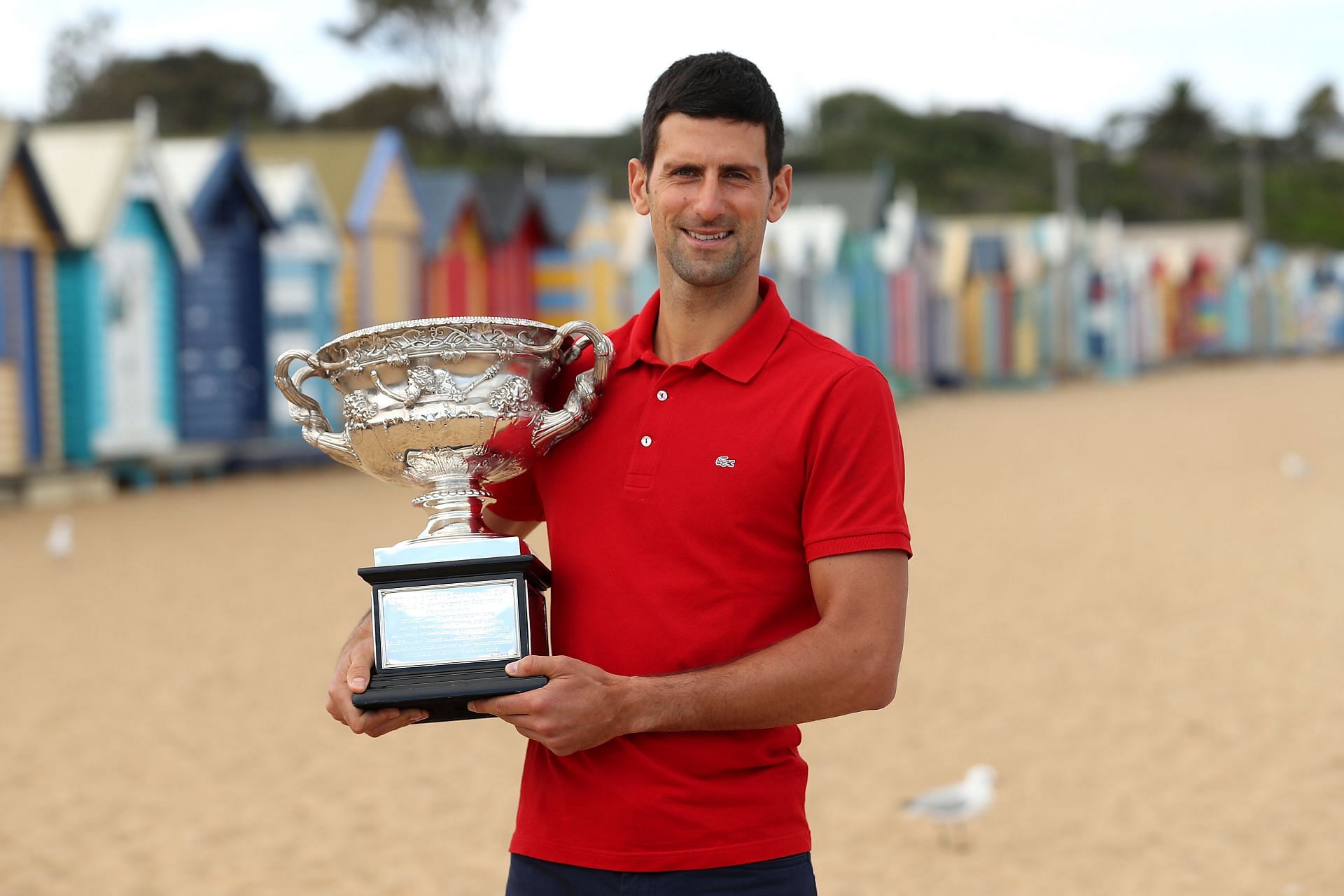 Novak Djokovic poses with the 2021 Australian Open trophy