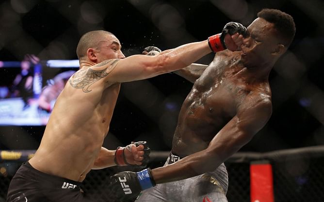 Michael Bisping on the weaknesses Robert Whittaker has spotted in Israel Adesanya's fighting style - "He's talking about takedowns in the middle of the octagon"