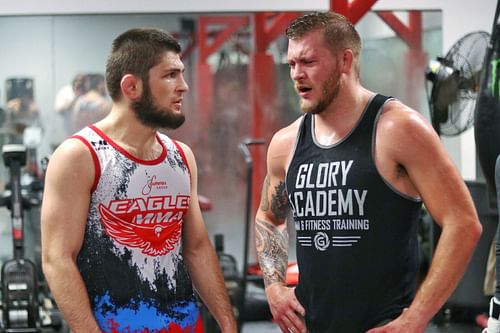 Khabib Nurmagomedov (L) converses with Tyler Minton (R)