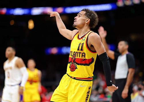 Trae Young #11 of the Atlanta Hawks reacts after shooting a three-point basket against the Los Angeles Lakers during the second half at State Farm Arena on January 30, 2022 in Atlanta, Georgia.