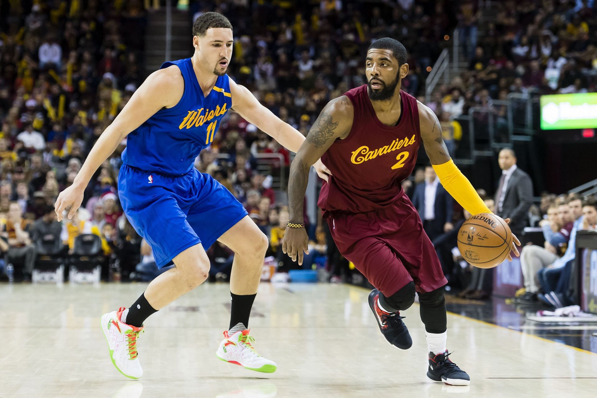 Klay Thompson #11 of the Golden State Warriors puts pressure on Kyrie Irving #2 of the Cleveland Cavaliers