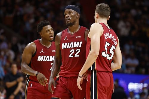 Kyle Lowry (left) with Jimmy Butler (center) and Duncan Robinson (right)