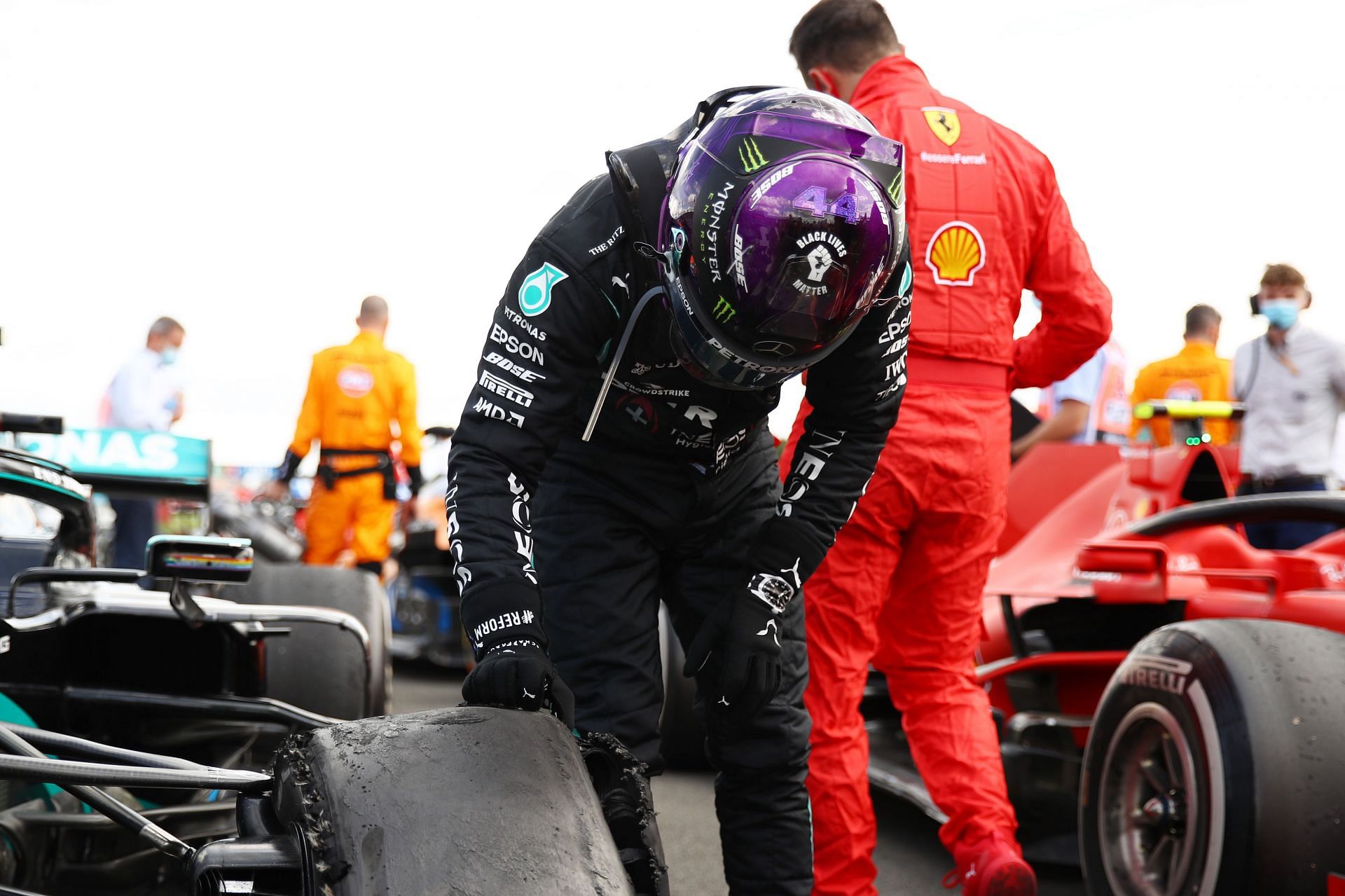 F1 Grand Prix of Great Britain - Lewis Hamilton inspects what remains of his tire