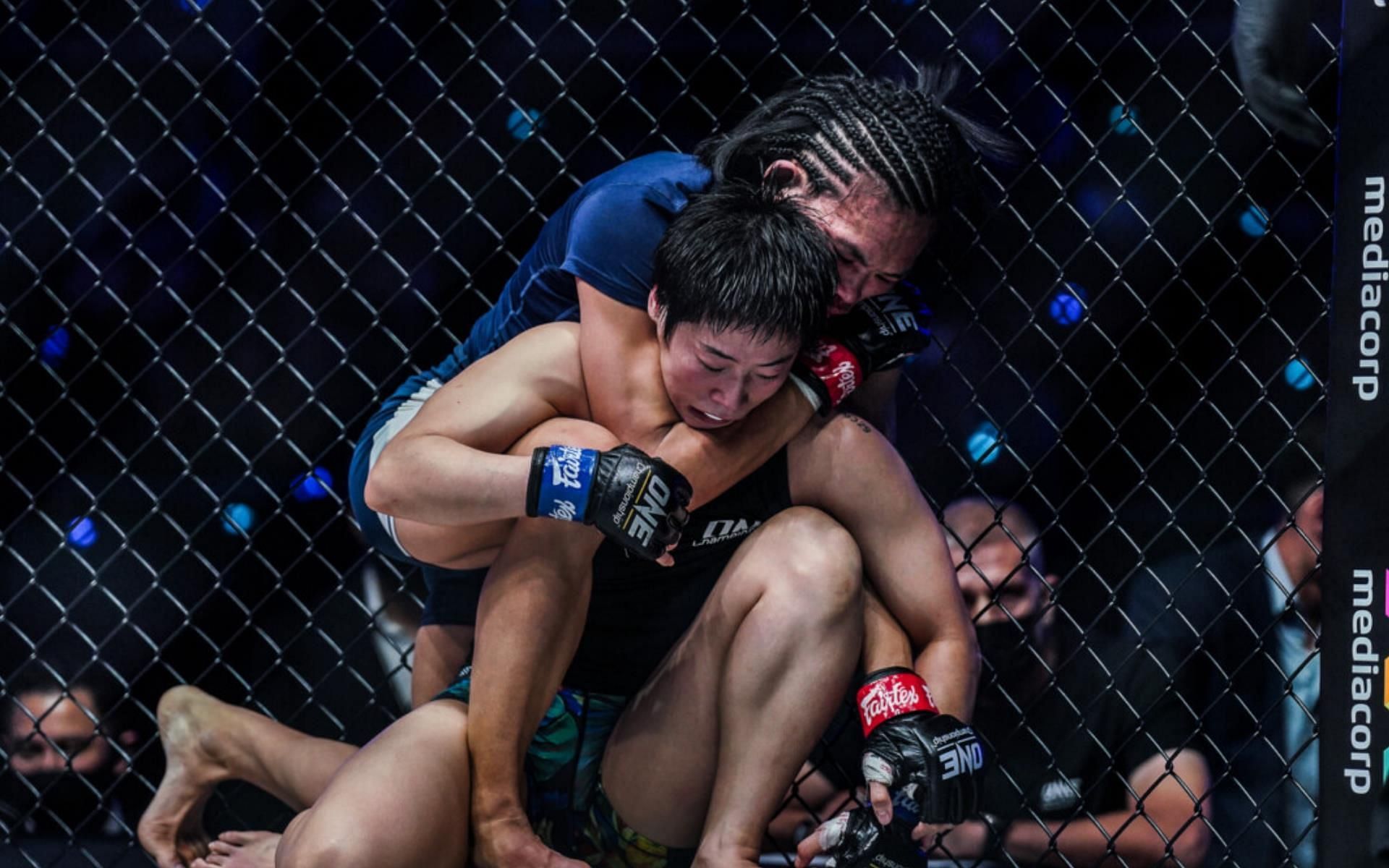 Tiffany Teo (Background) finishes Meng Bo (Foreground) at ONE: Heavy Hitters. | [Photo: ONE Championship]