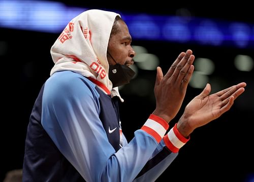 Brooklyn Nets' Kevin Durant cheering on his teammates from the sidelines