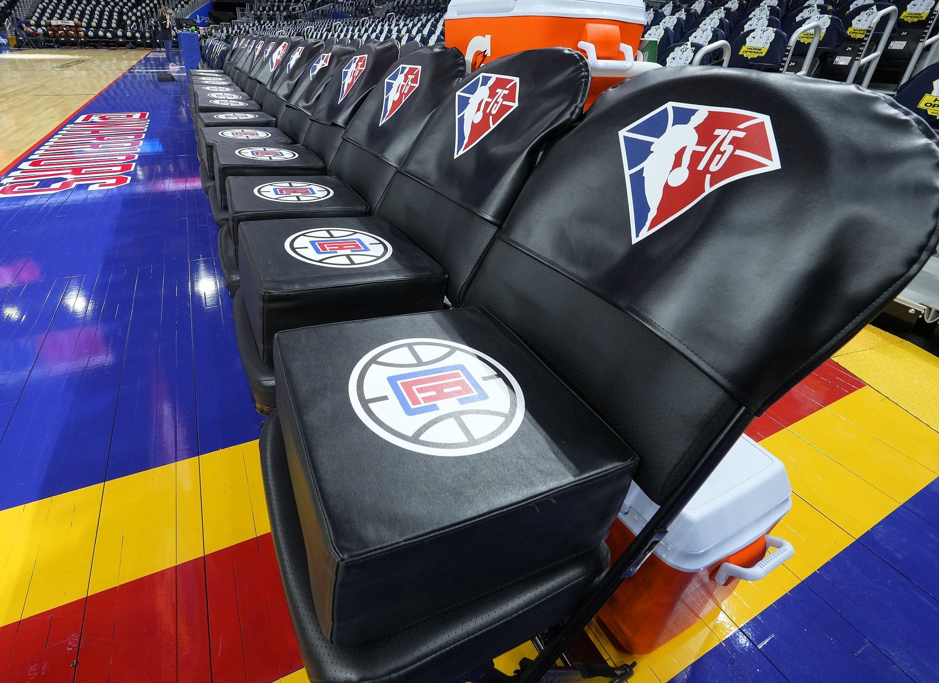 A detailed view of the Los Angeles Clippers&#039; bench with the NBA&#039;s 75th anniversary logo.