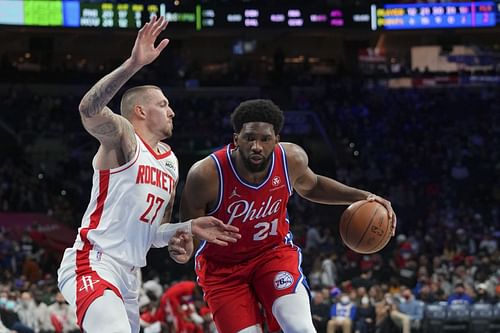 Daniel Theis of the Houston Rockets guards Joel Embiid of the Philadelphia 76ers