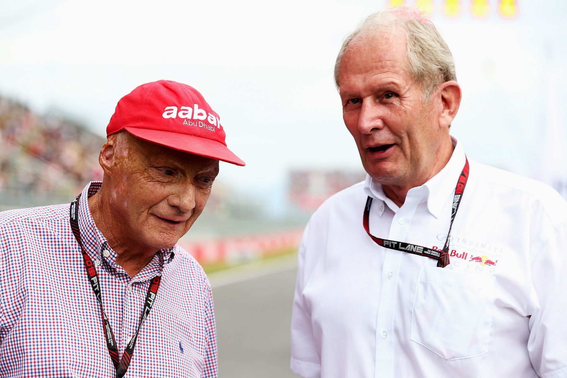 Niki Lauda and Dr. Helmut Marko talk on the grid before a race (Photo by Mark Thompson/Getty Images)