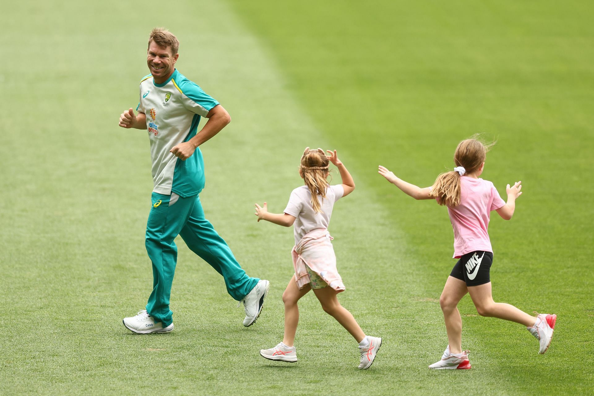 David Warner enjoys some time with his kids during a training session