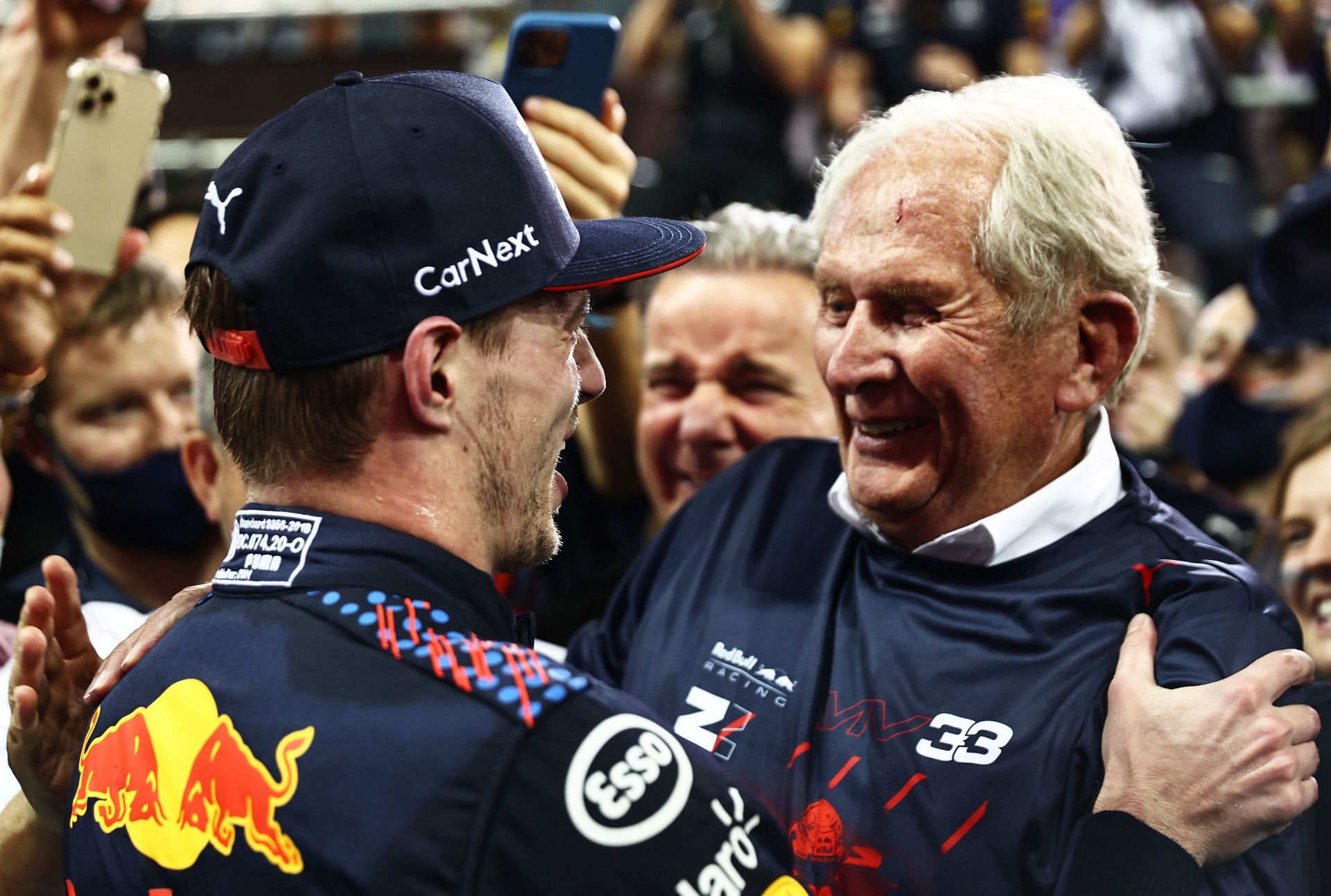Max Verstappen (left) and Dr. Helmut Marko (right) celebrate after the 2021 Abu Dhabi Grand Prix (Photo by Mark Thompson/Getty Images)
