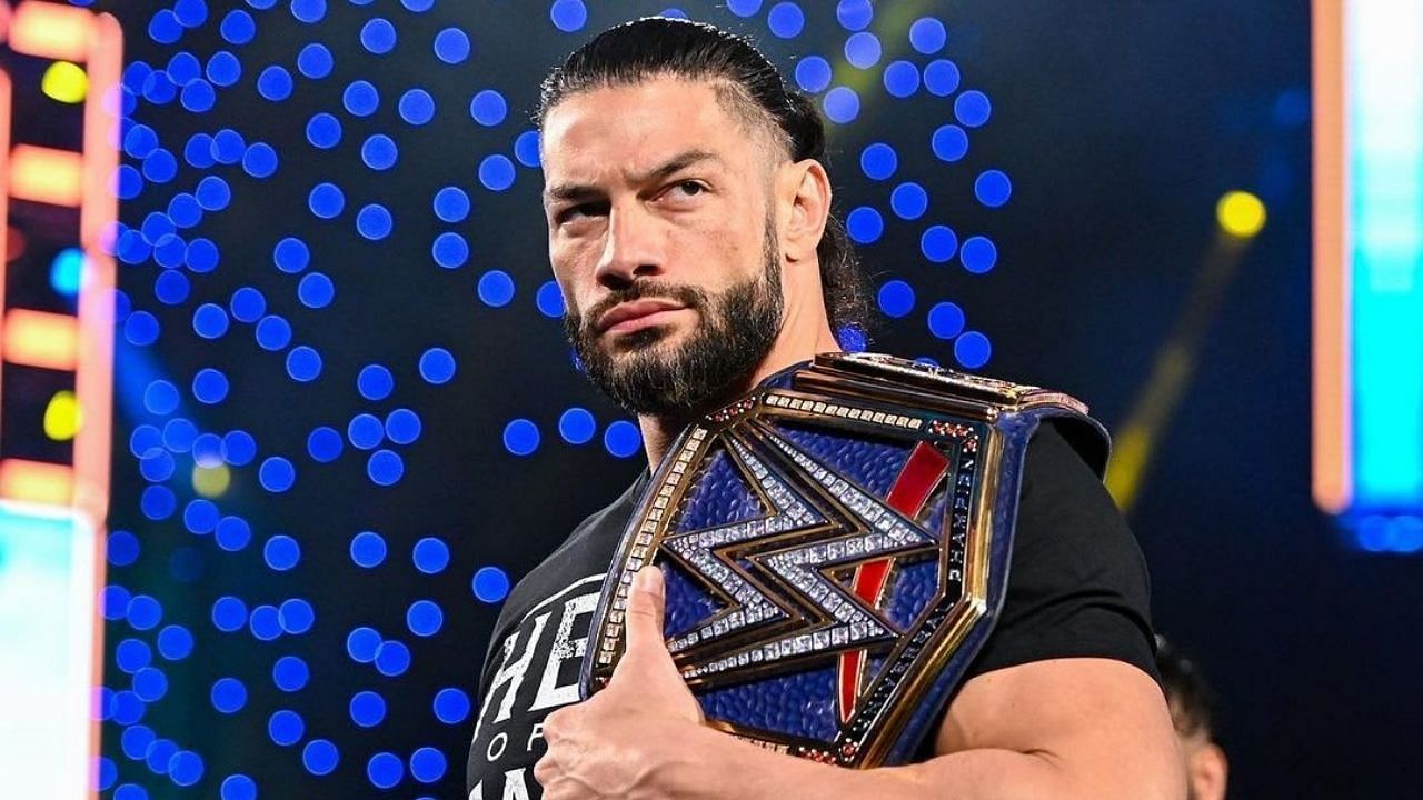 Reigns posing with the Universal Championship