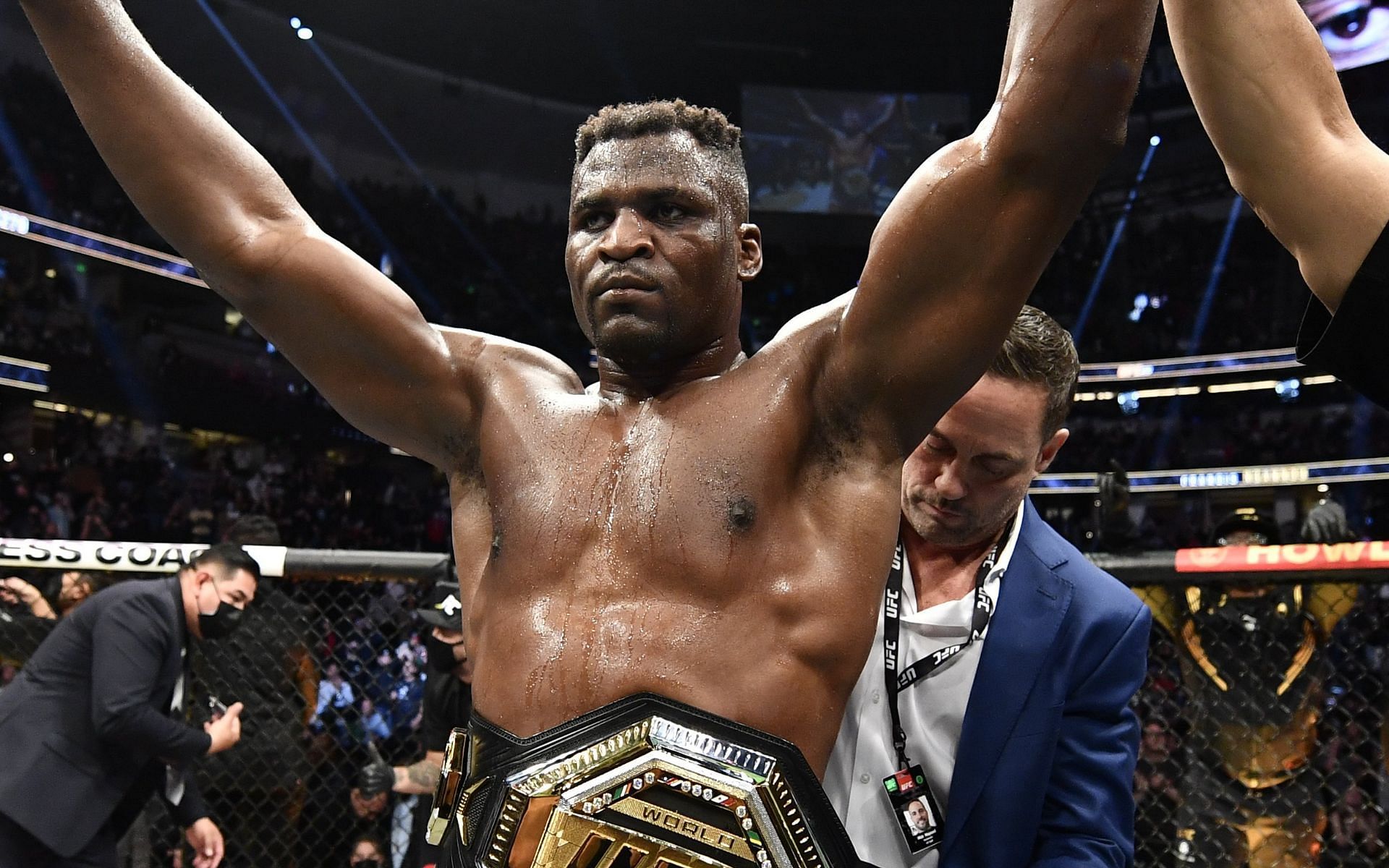 Mick Maynard presented Francis Ngannou with his world title after he defeated Ciryl Gane at UFC 270 [Image via @SpinninBackfist on Twitter]