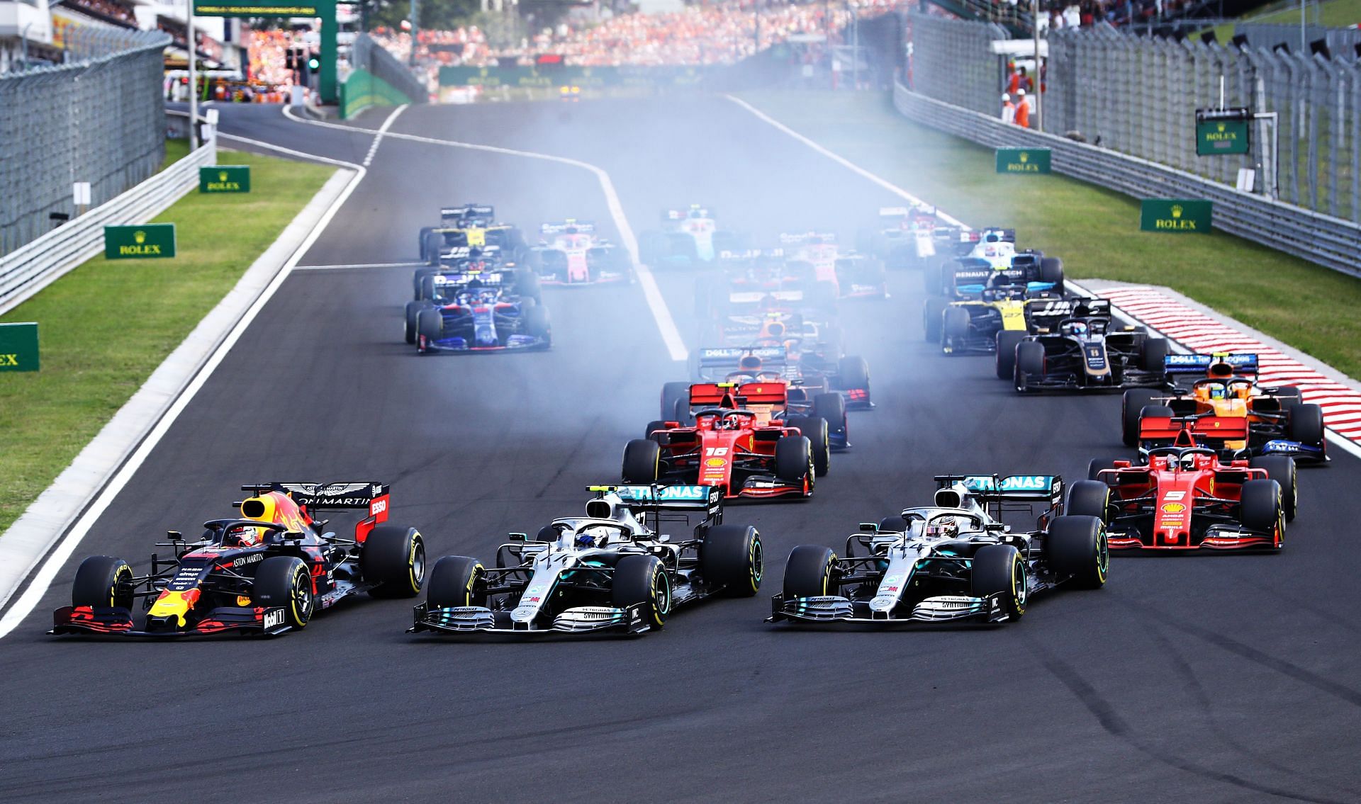 Valtteri Bottas (center) put under pressure by Lewis Hamilton (right) at the 2019 Hungarian Grand Prix (Photo by Mark Thompson/Getty Images)