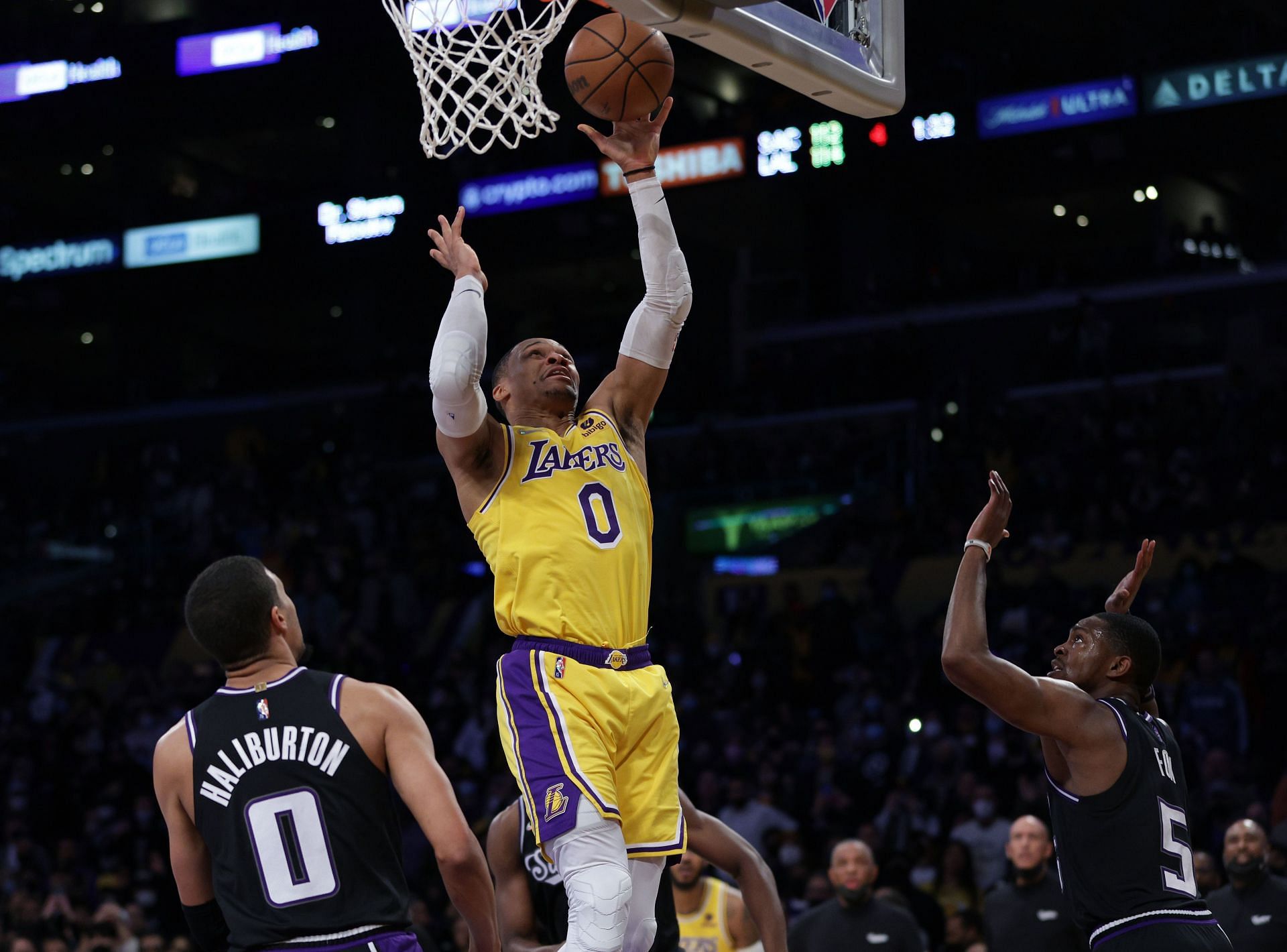Russell Westbrook of the LA Lakers scores on a layup between Tyrese Haliburton and De&#039;Aaron Fox of the Sacramento Kings during a 122-114 Los Angeles Lakers&#039; win on Jan. 4 in Los Angeles, California.