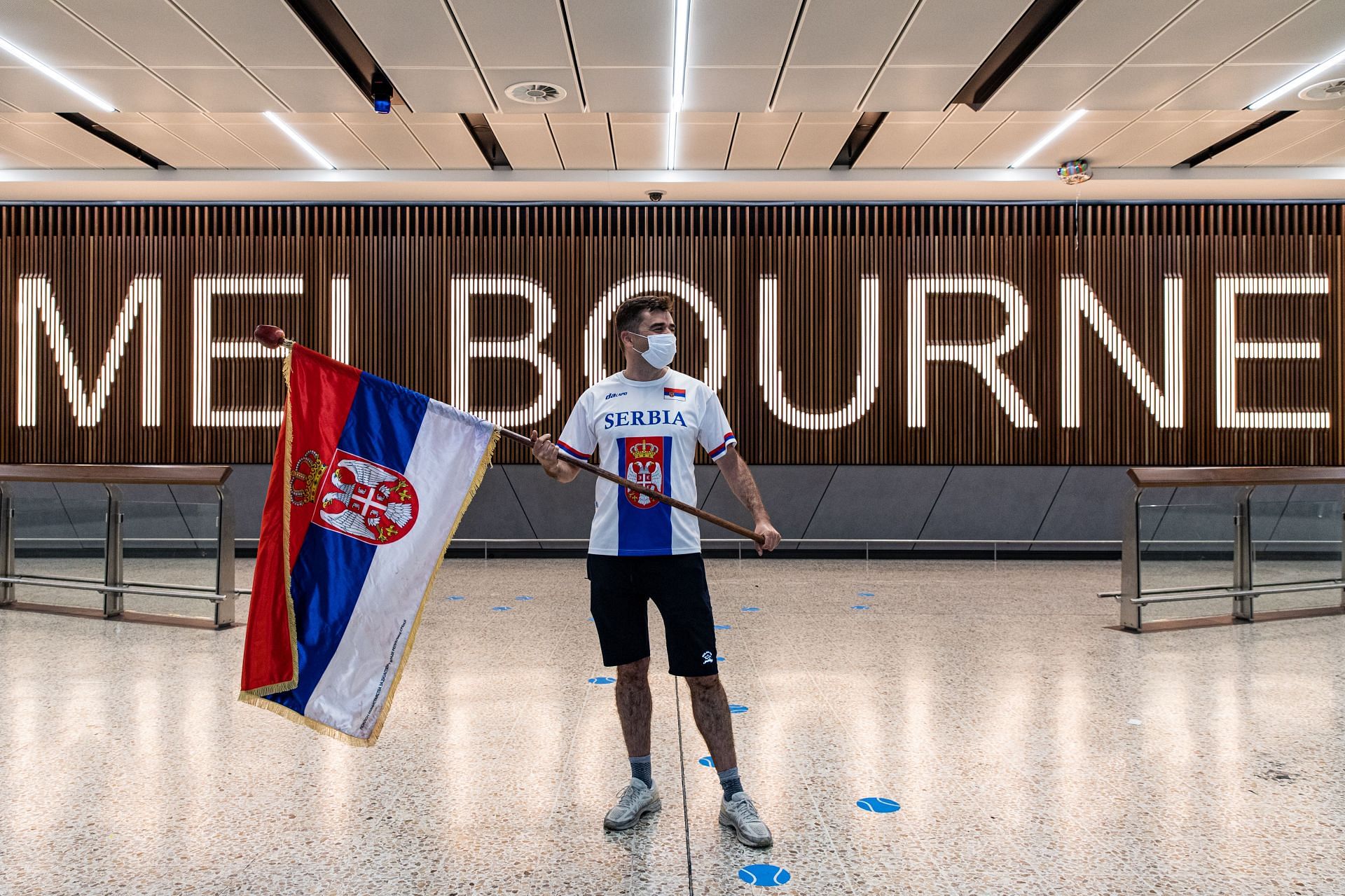 A fan awaiting the arrival of Novak Djokovic at Melbourne Airport