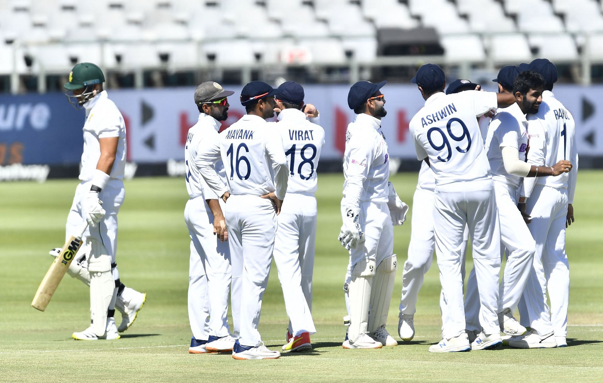 Indian players celebrate the fall of a South African wicket.