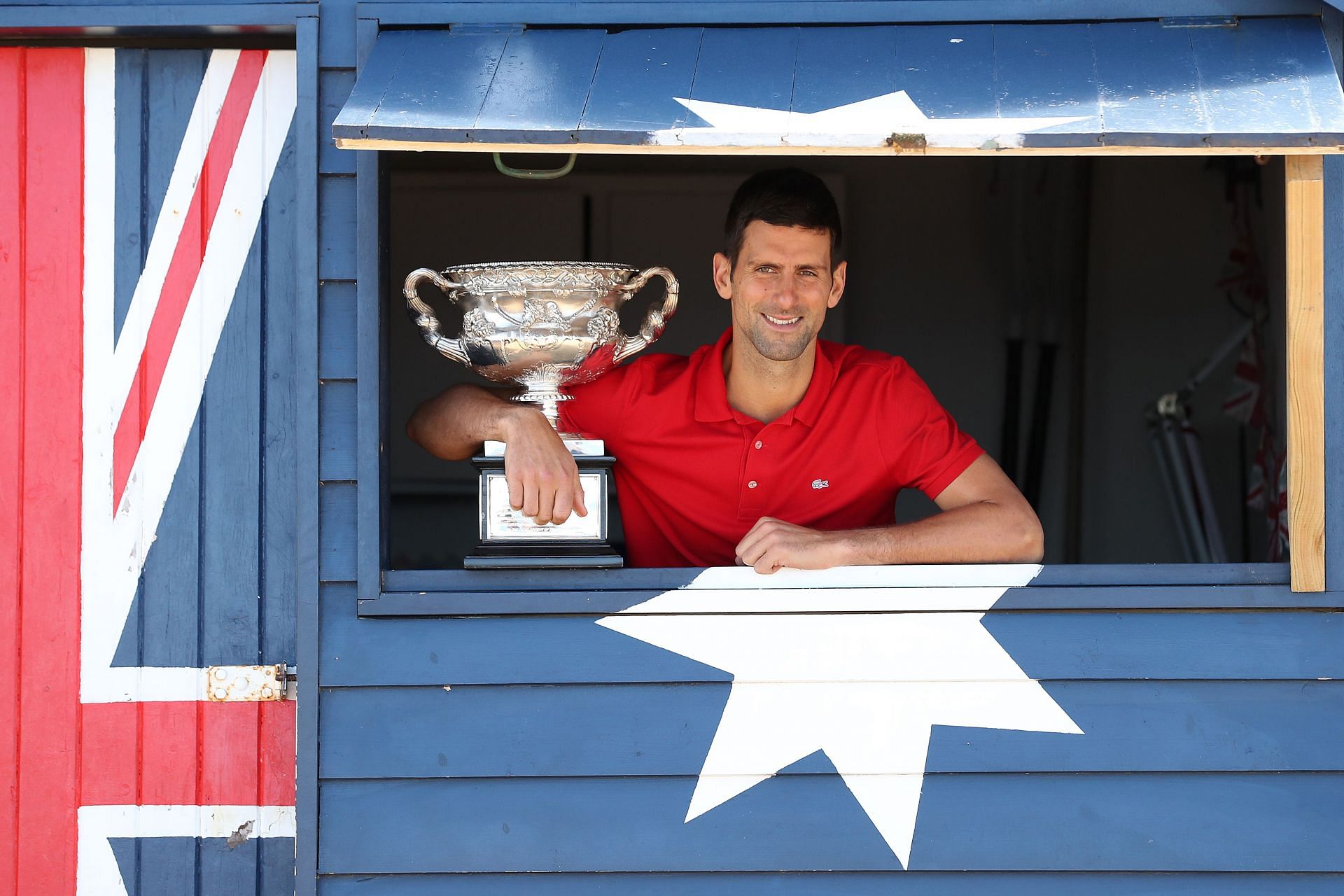 Novak Djokovic poses with the 2021 Australian Open trophy