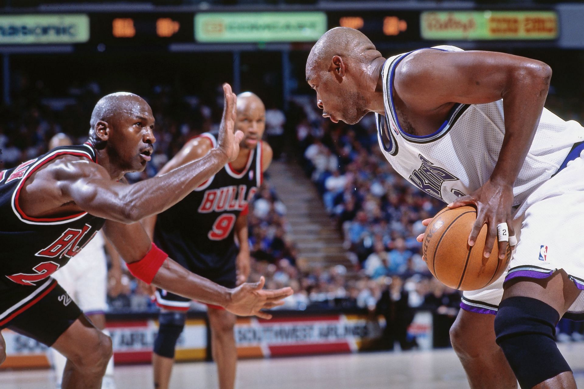 Michael Jordan and Mitch Richmond in NBA action.