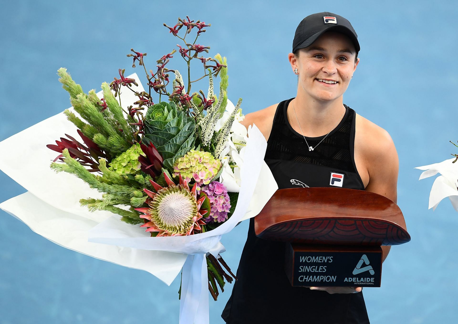 Ashleigh Barty of Australia holds the Womens Singles Champion trophy after defeating Elena Rybakina of Kazakhstan at the 2022 Adelaide International in Adelaide, Australia.