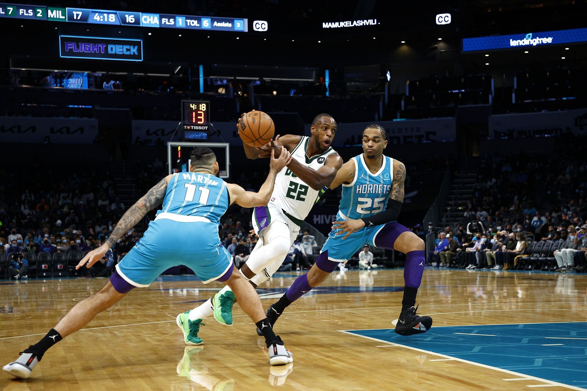 Khris Middleton of the Milwaukee Bucks drives to the basket