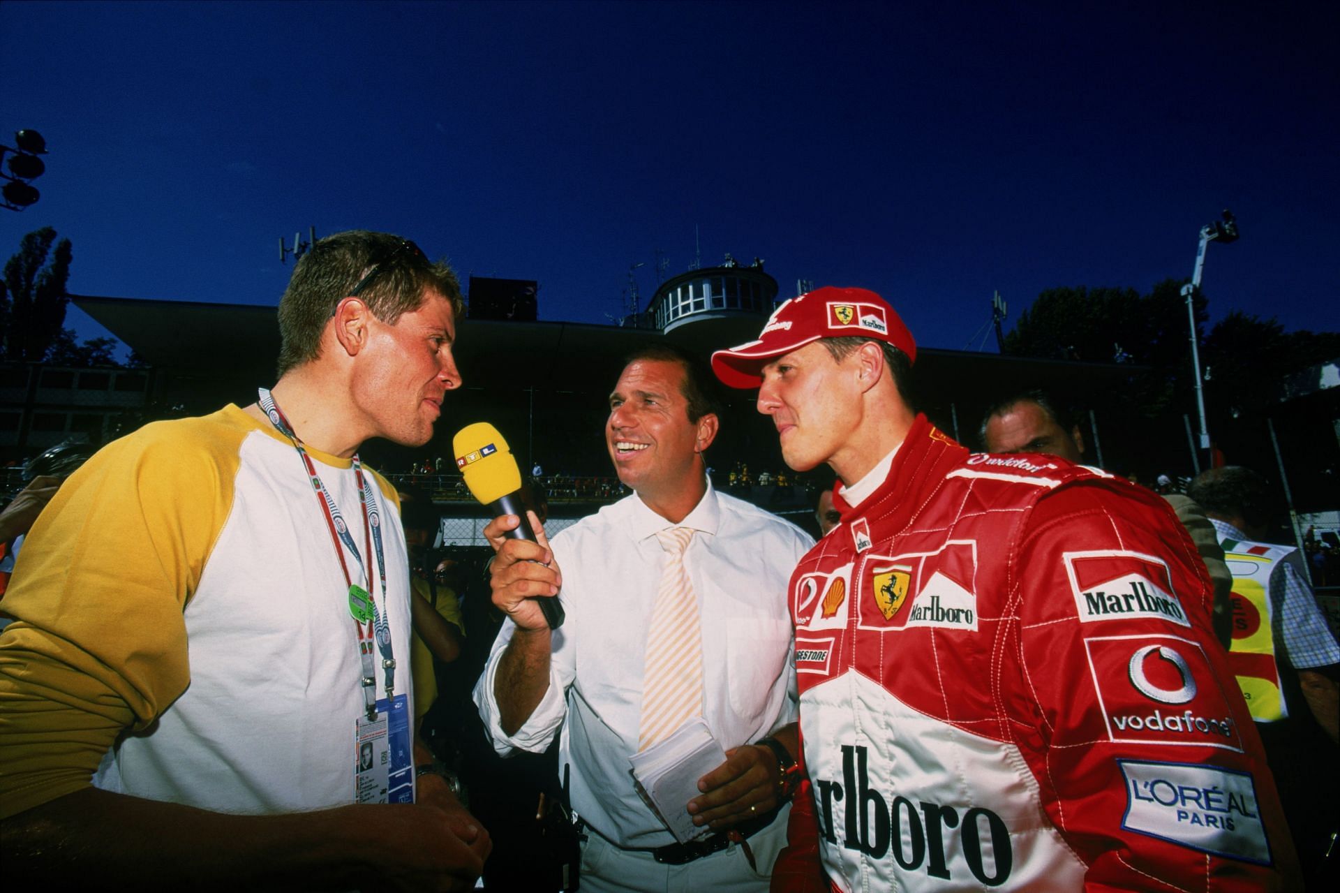 Michael Schumacher (right) was shielded from team politics and the Italian media by Ross Brawn and Jean Todt/