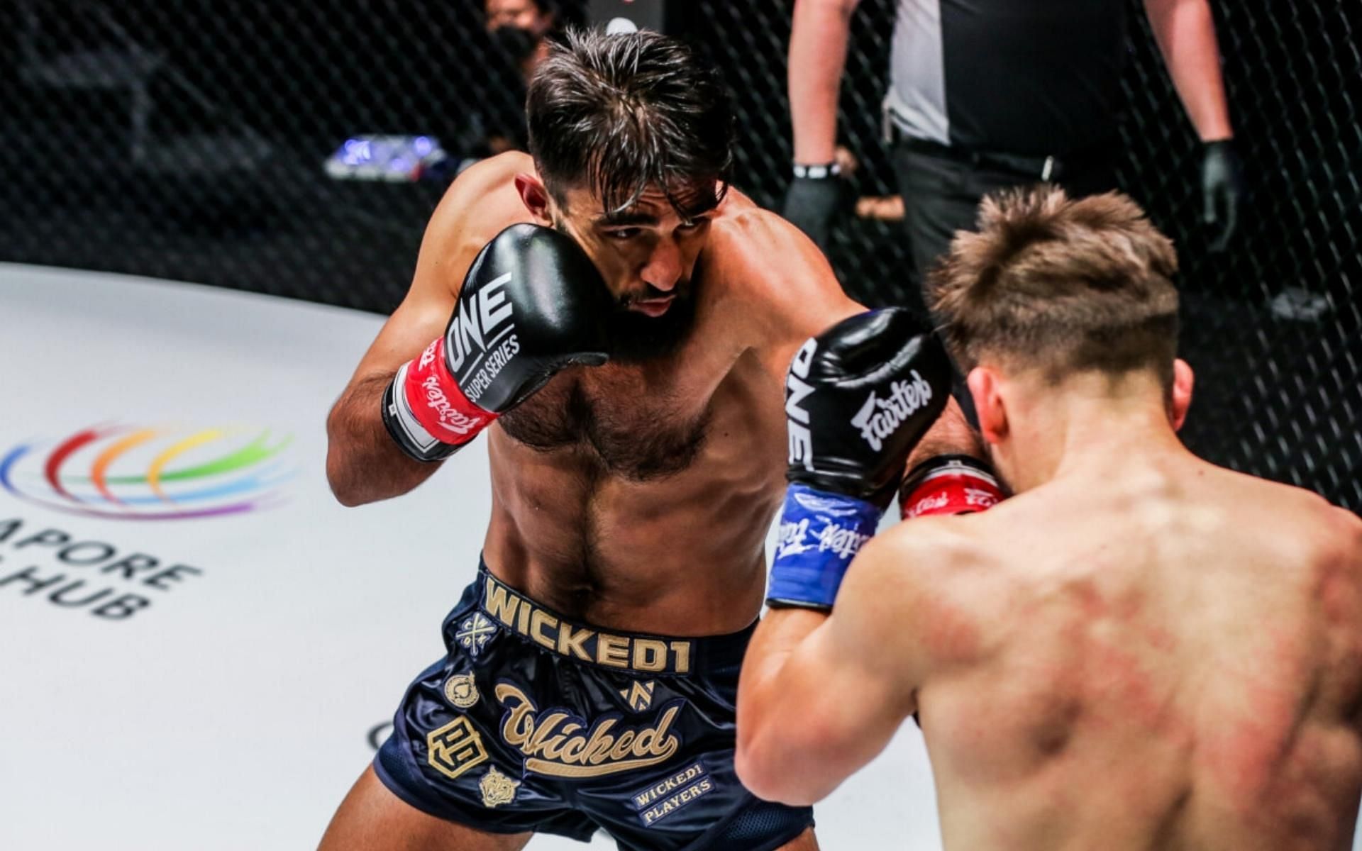 Marat Grigorian (left) put on a striking clinic against Andy Souwer (right) in the quarterfinals of ONE featherweight kickboxing world Grand Prix tournament. (Image courtesy of ONE Championship)