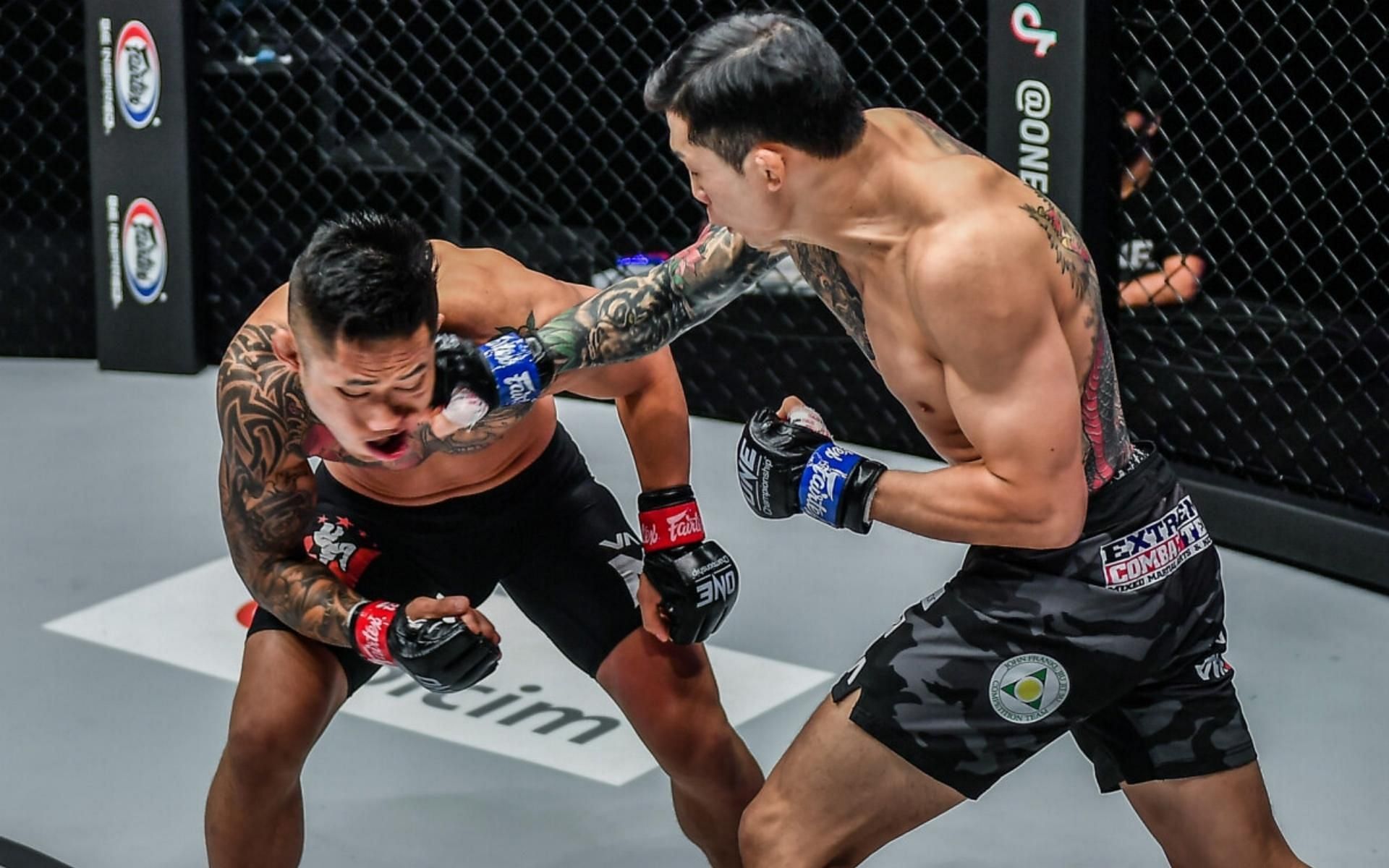 Kim Jae Woong (right) knocked out former ONE Championship world champion Martin Nguyen (left) inside one round. (Image courtesy of ONE Championship)