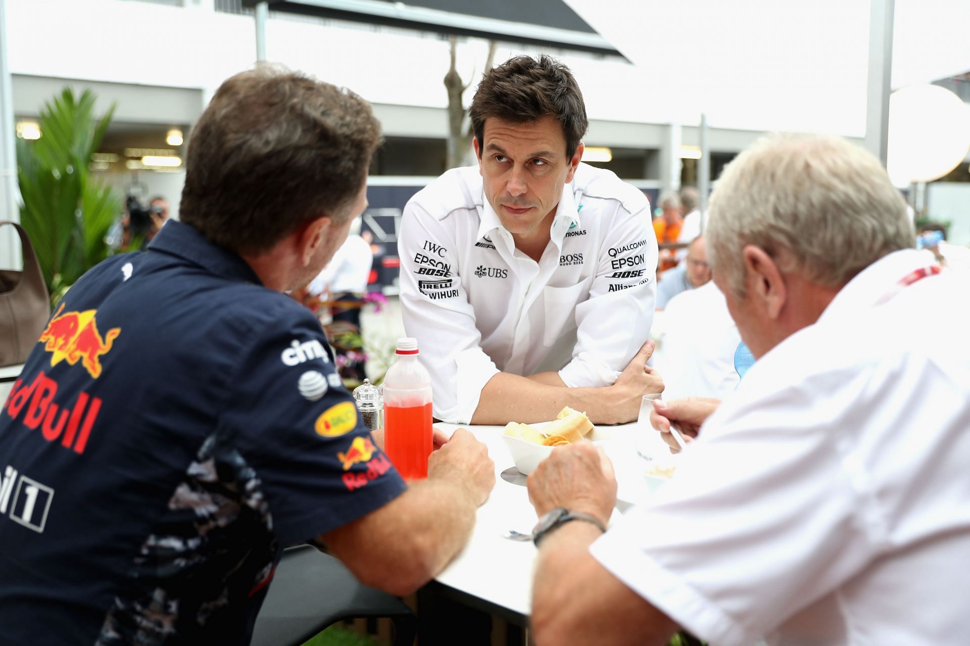 Mercedes GP Executive Director Toto Wolff talks with Red Bull Racing Team Principal Christian Horner and Red Bull Racing Team Consultant Dr Helmut Marko in the Paddock. (Photo by Mark Thompson/Getty Images)