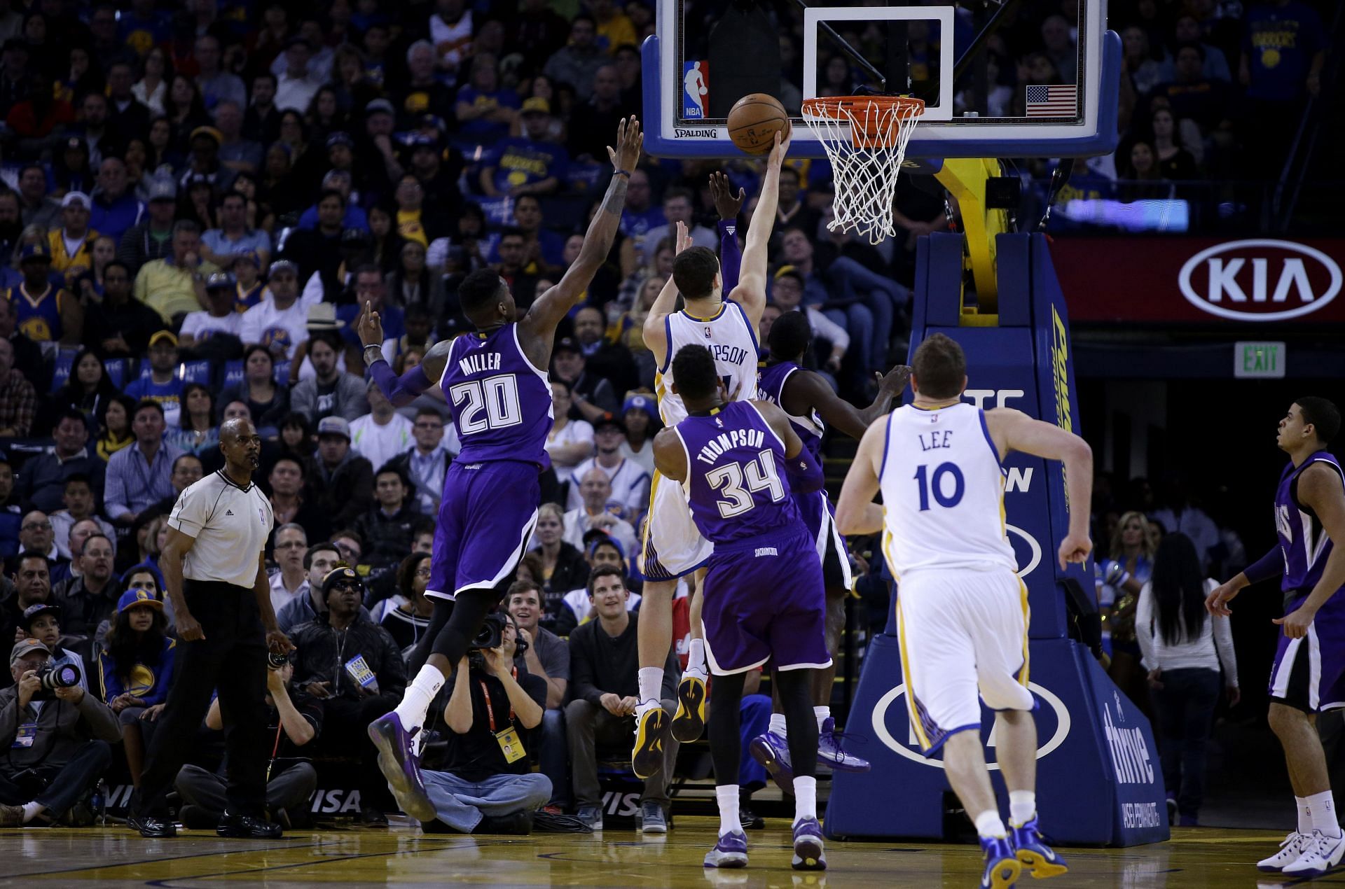 Klay Thompson #11 of the Golden State Warriors goes up for a shot on Quincy Miller #20 of the Sacramento Kings