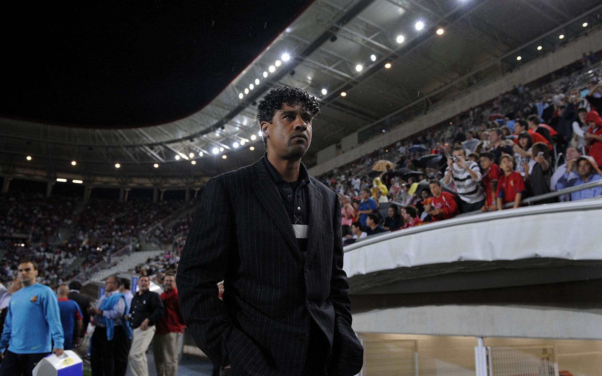 Frank Rijkaard looks on during a Barcelona La Liga game.