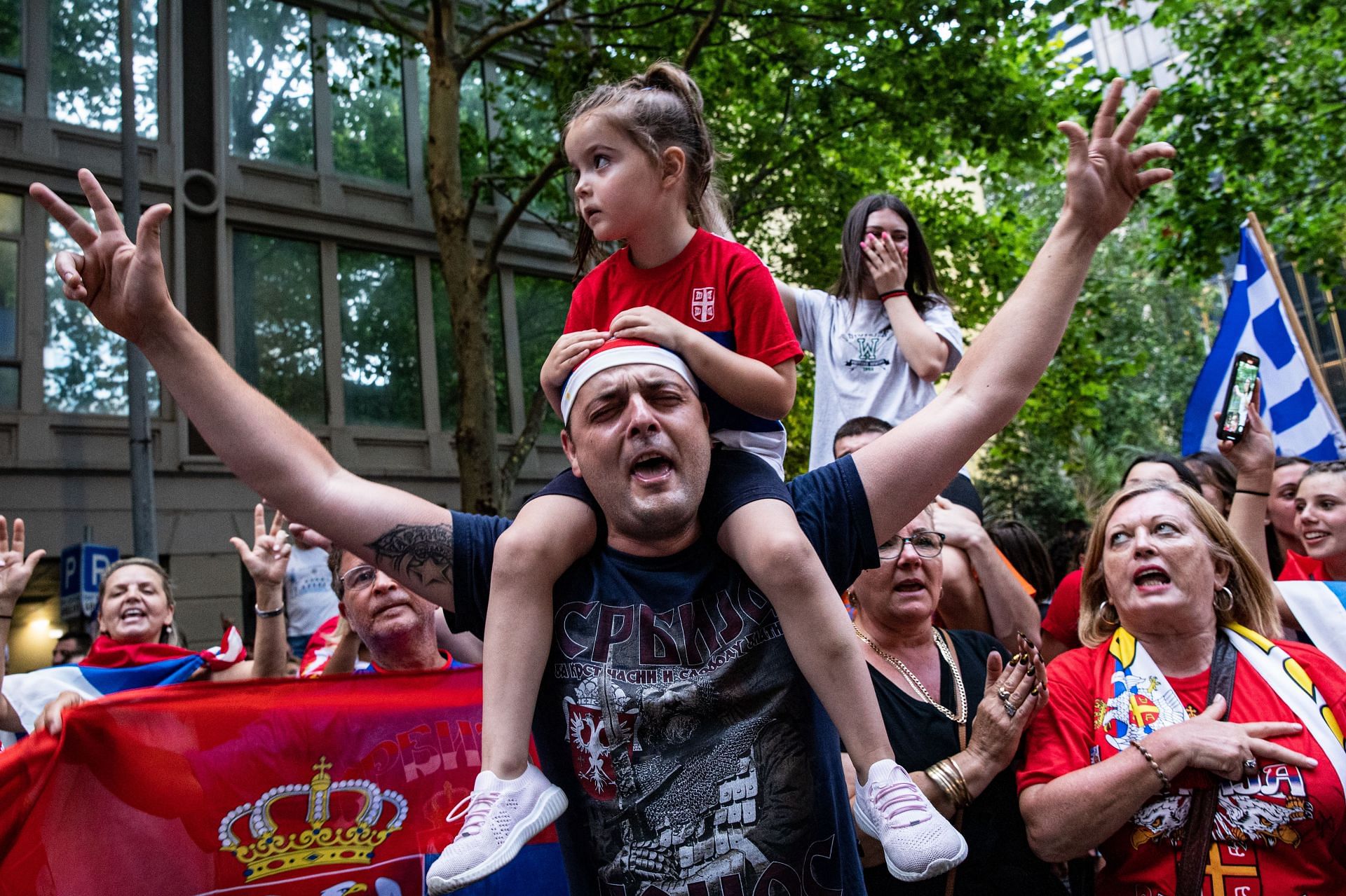 Fans gather outside Melbourne's Rialto Towers to show their support for Novak Djokovic