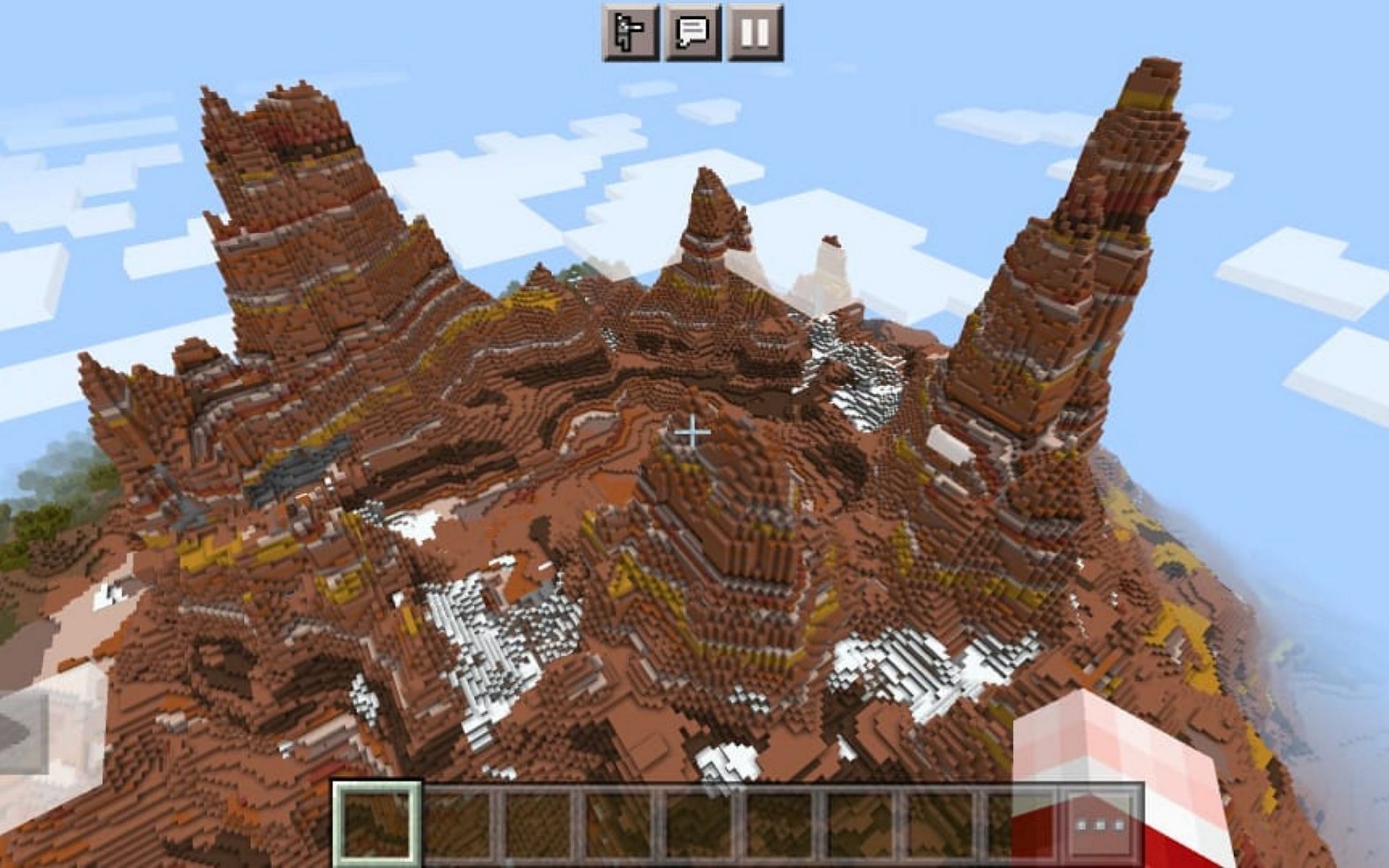 Huge Badland mountains with a sprinkle of snow (Image via Minecraft)