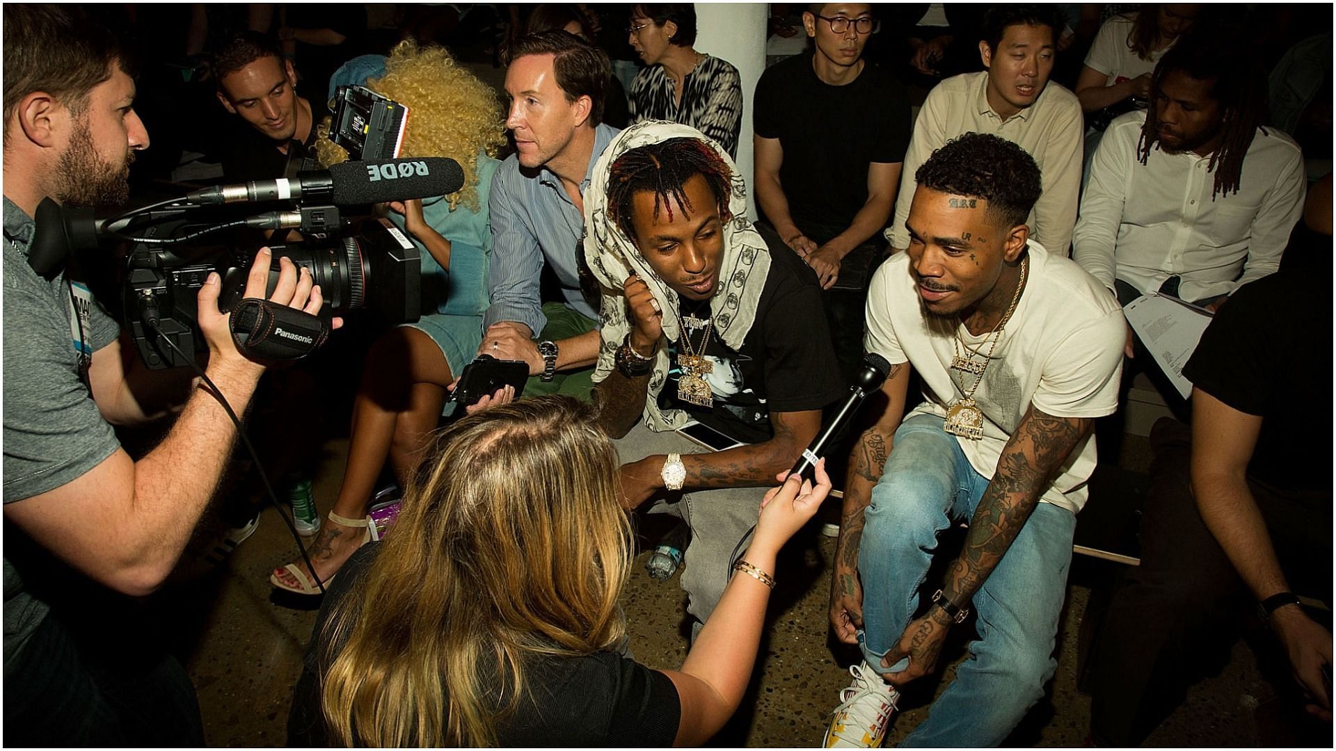 Rich the kid and Rapper J Stash being interviewed before the Pyer Moss fashion show during MADE Fashion Week September 2016 at Milk Studios (Image via Colby Blount/Getty Images)