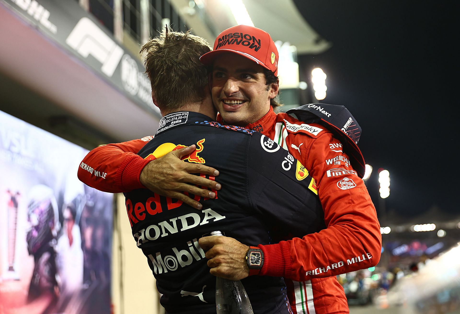 F1 Grand Prix of Abu Dhabi - Carlos Sainz Jr. embraces Max Verstappen