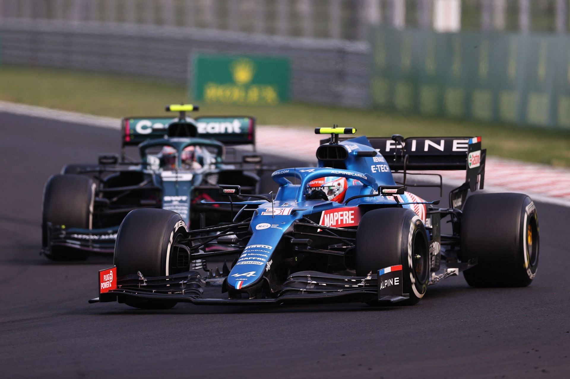 Esteban Ocon (#31) Alpine AS21 held off Sebastian Vettel (#5) Aston Martin to take his maiden victory at the 2021 Hungarian Grand Prix