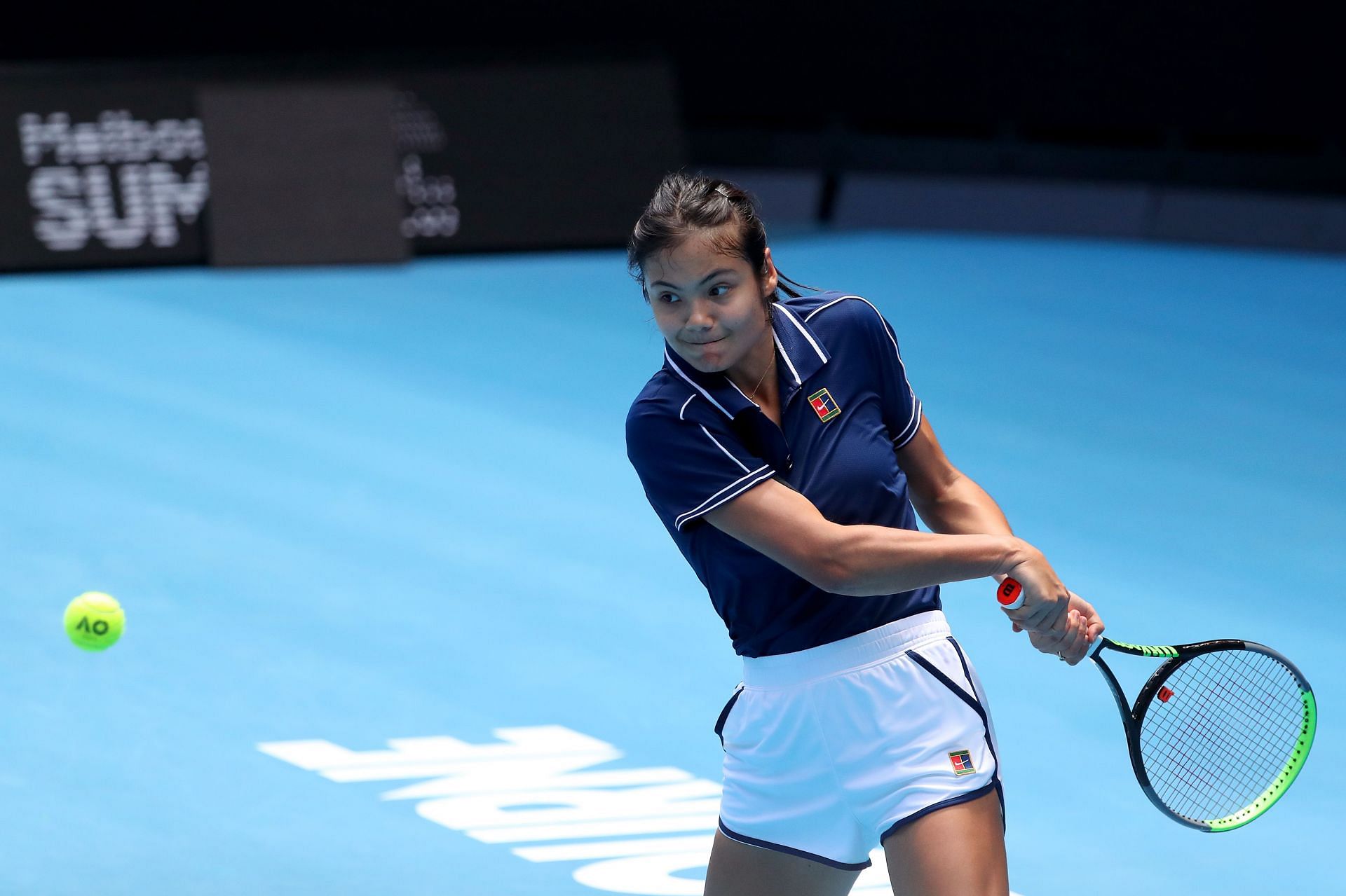 Emma Raducanu of Great Britain plays a backhand during a practice session at Melbourne Park