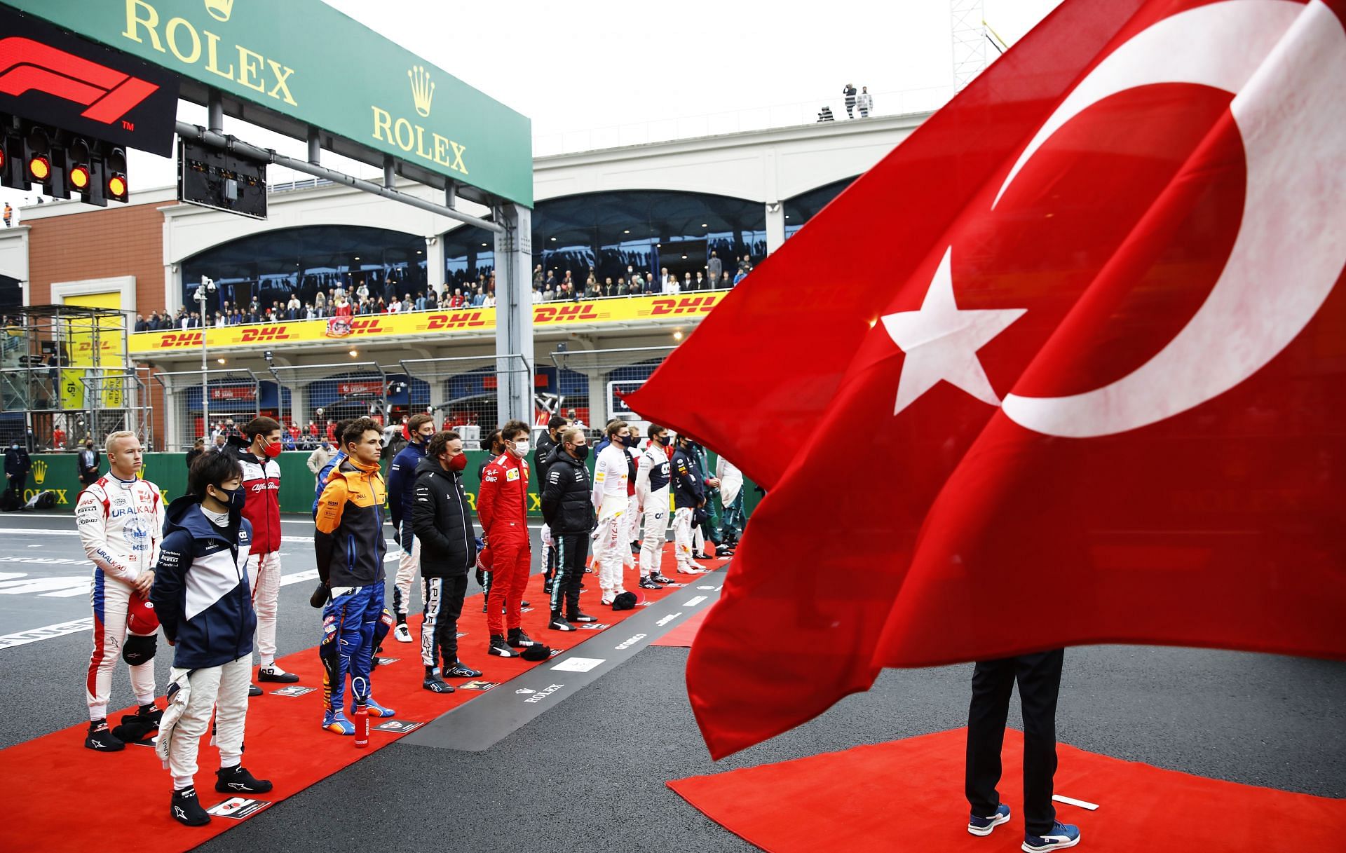 The drivers stand for the national anthem on the grid during the 2021 Turkish GP at the Istanbul Park
