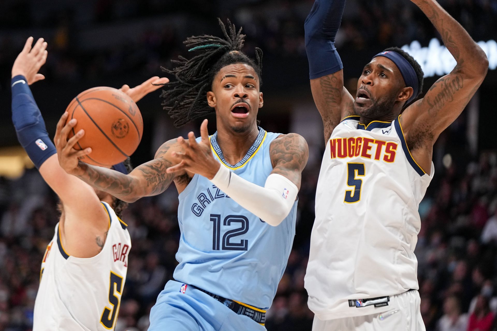 Ja Morant attempts a tough layup against Will Barton