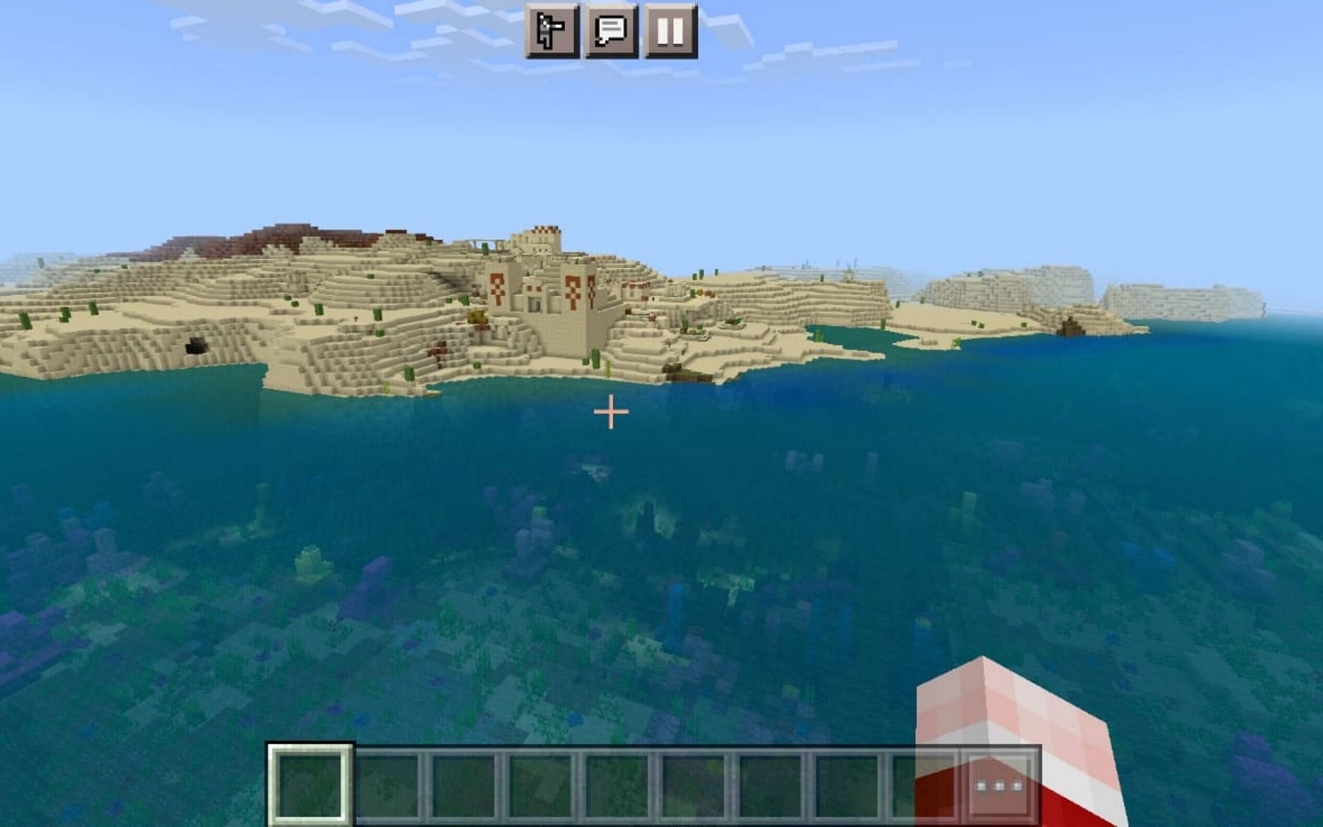 A desert temple, village and corals at spawn (Image via Minecraft)