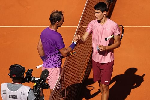 The 20-time Major winner shakes hands with Carlos Alcaraz