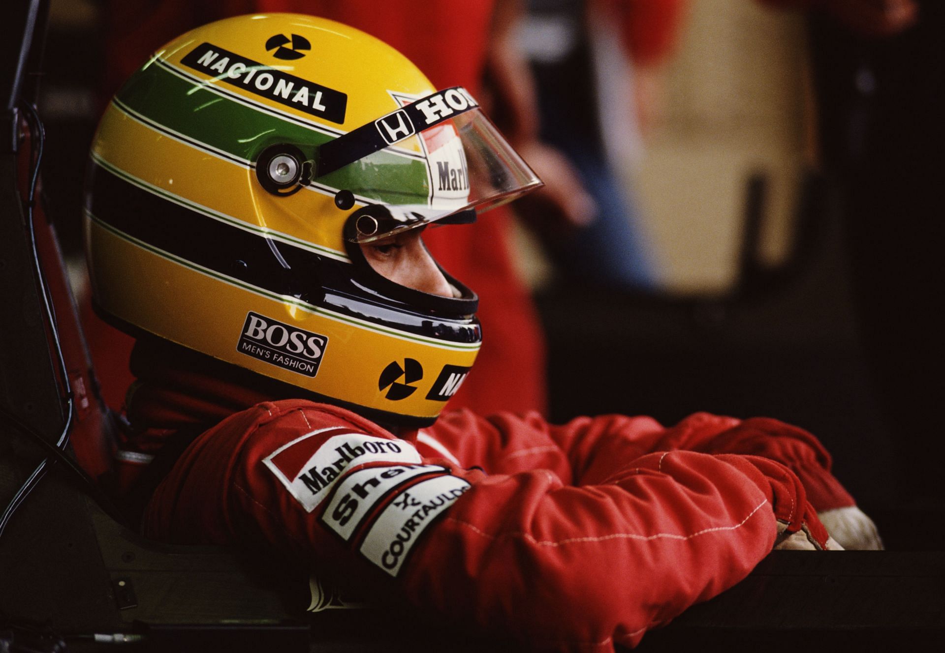 Ayrton Senna sits aboard his McLaren before the Fuji Television Japanese Grand Prix in October 1989 at the Suzuka Circuit in  Japan (Photo by Pascal Rondeau/Getty Images)