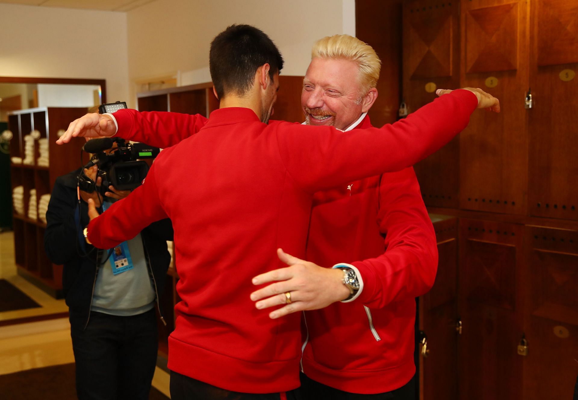 Novak Djokovic hugs Boris Becker at the 2016 French Open