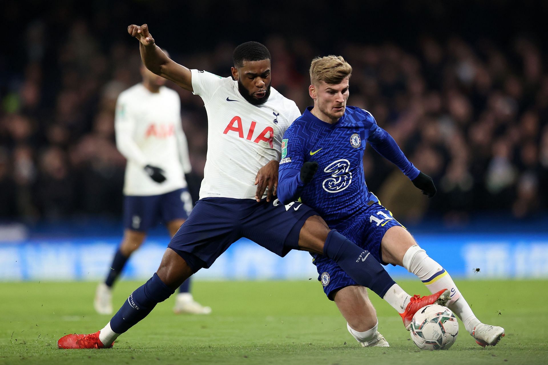 Japhet Tanganga tussles it out with Timo Werner.