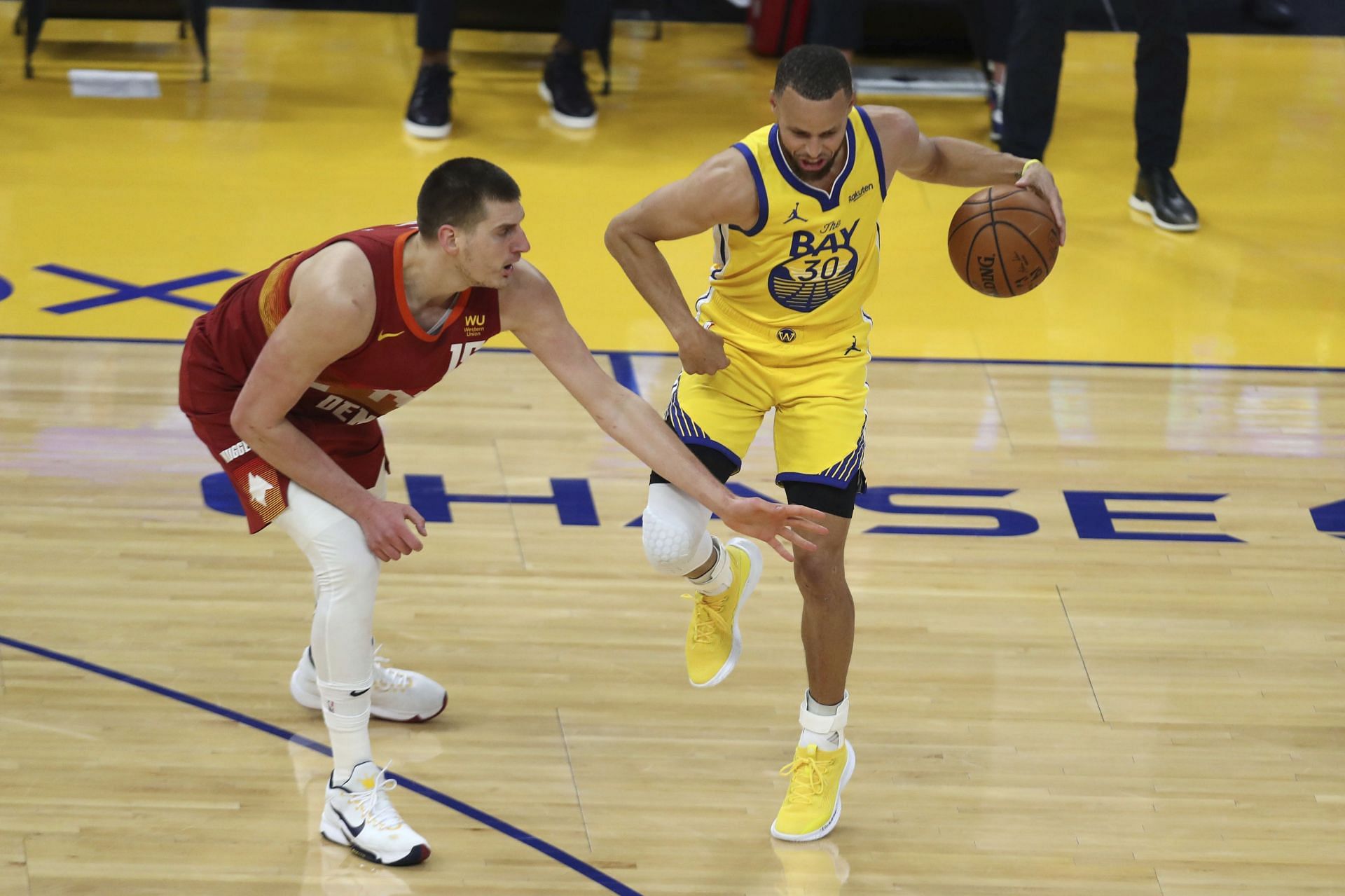 Nikola Jokic of the Denver Nuggets guarding the Golden State Warriors&#039; Steph Curry [Source: AP]