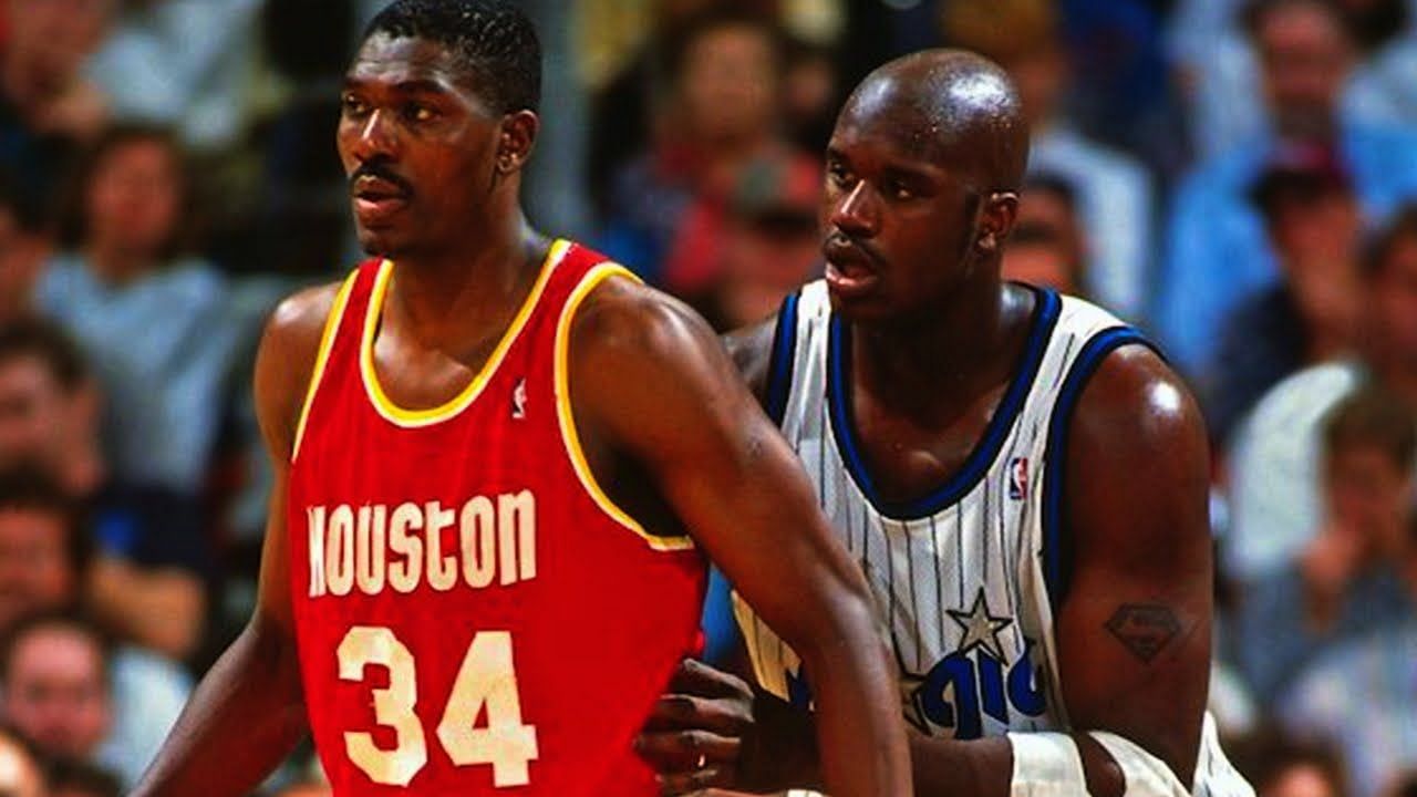 Shaquille O&#039;Neal of the Orlando Magic, right, defends Hakeem Olajuwon of the Houston Rockets in the 1995 NBA Finals