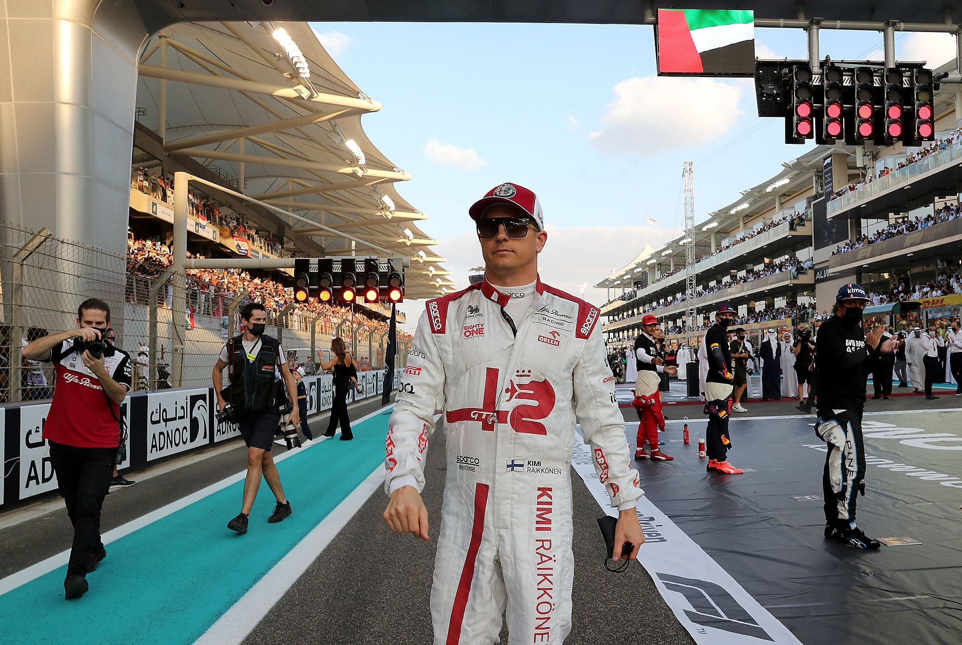 Kimi Raikkonen walks on the grid prior to the final race of his career in Abu Dhabi (Photo by Kamran Jebreili - Pool/Getty Images